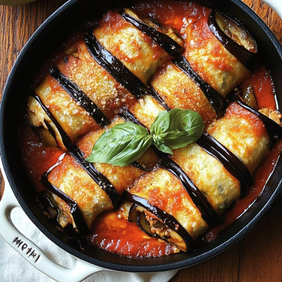 A pan of food with a green leaf on top.