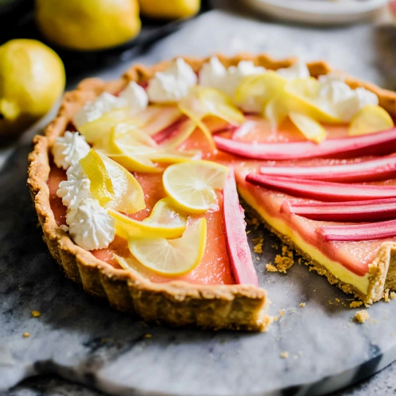 A slice of pie with lemon and apple slices.