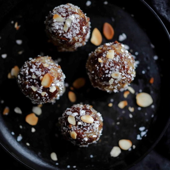 A plate of food with nuts on top.